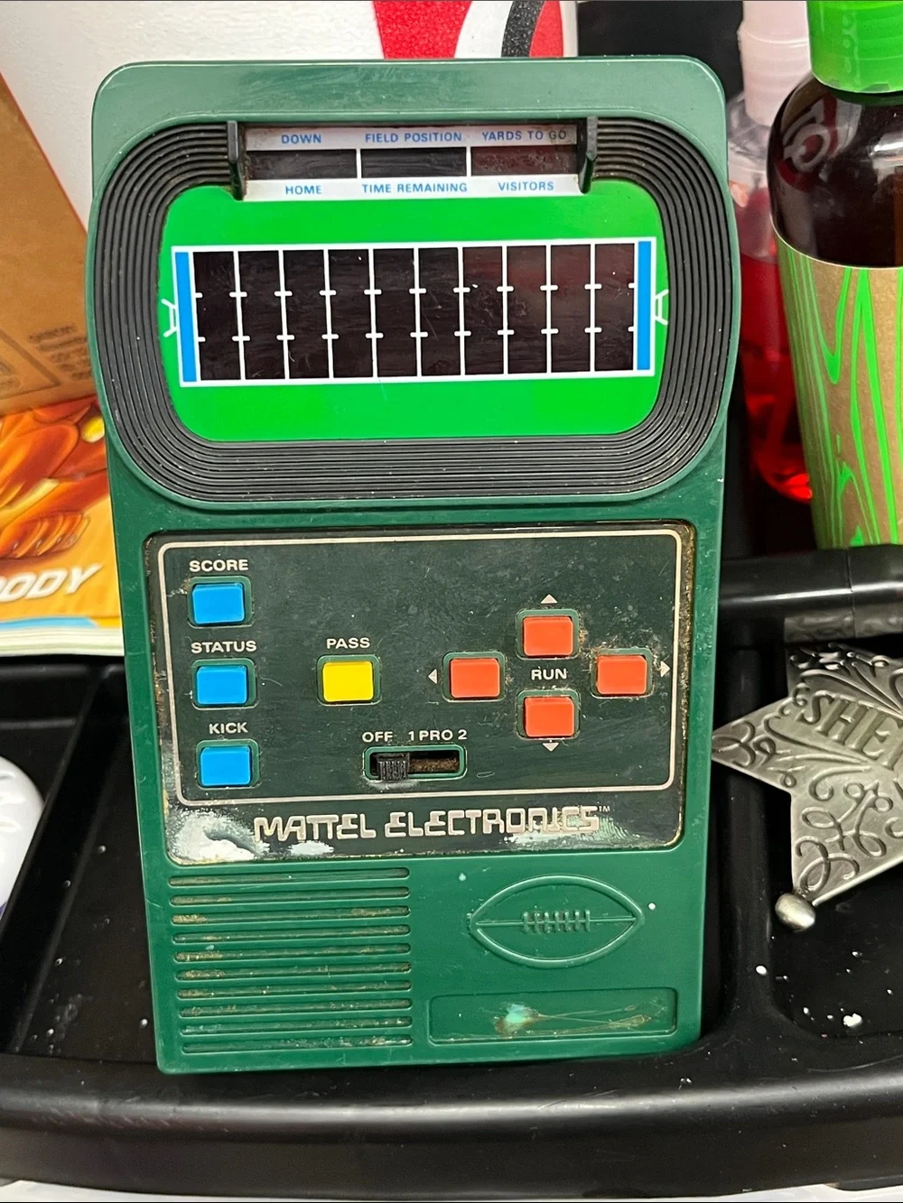 Mattel Green Handheld Electronic Football Game with Blue Yellow Orange Buttons